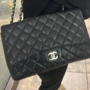 Chanel Jumbo Black Caviar Leather with Silver Hardware.